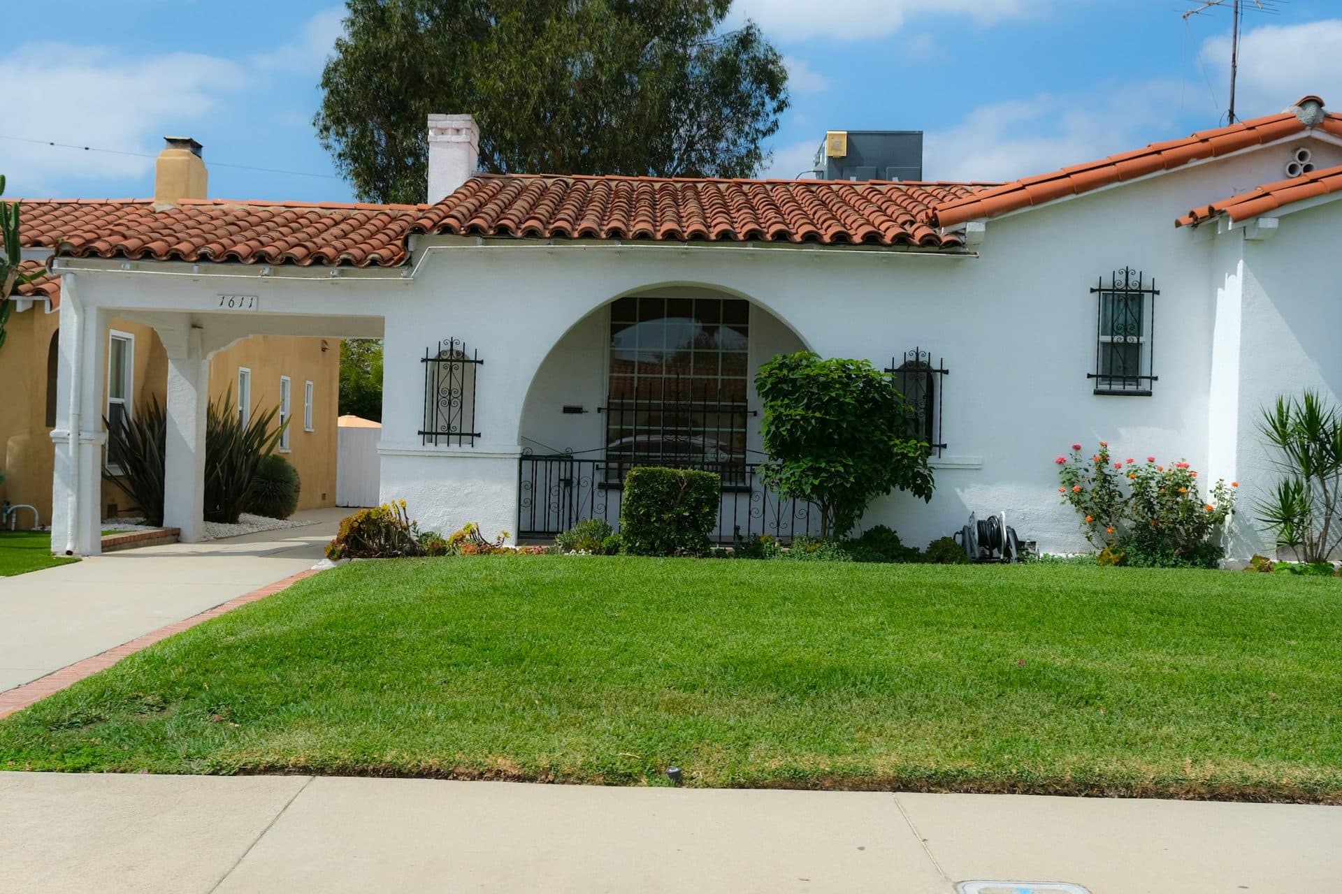 A Southern California stucco home with a clay barrel-tile roof